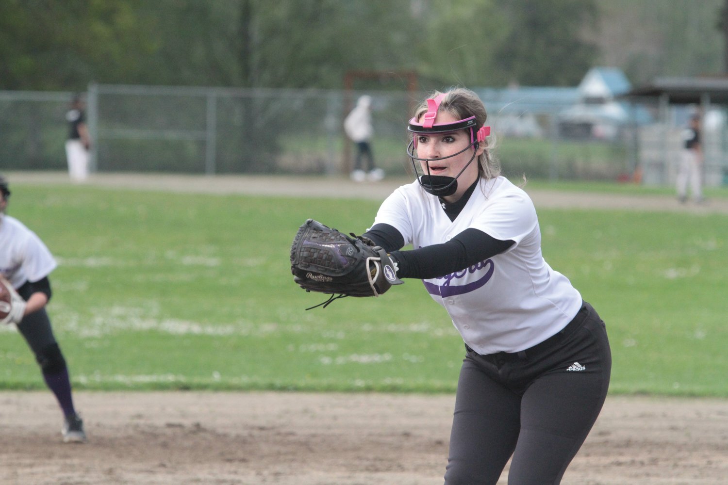 Quilcene pitcher Kayla Ward winds up during play against the Kings. She finished with eight strike-outs.